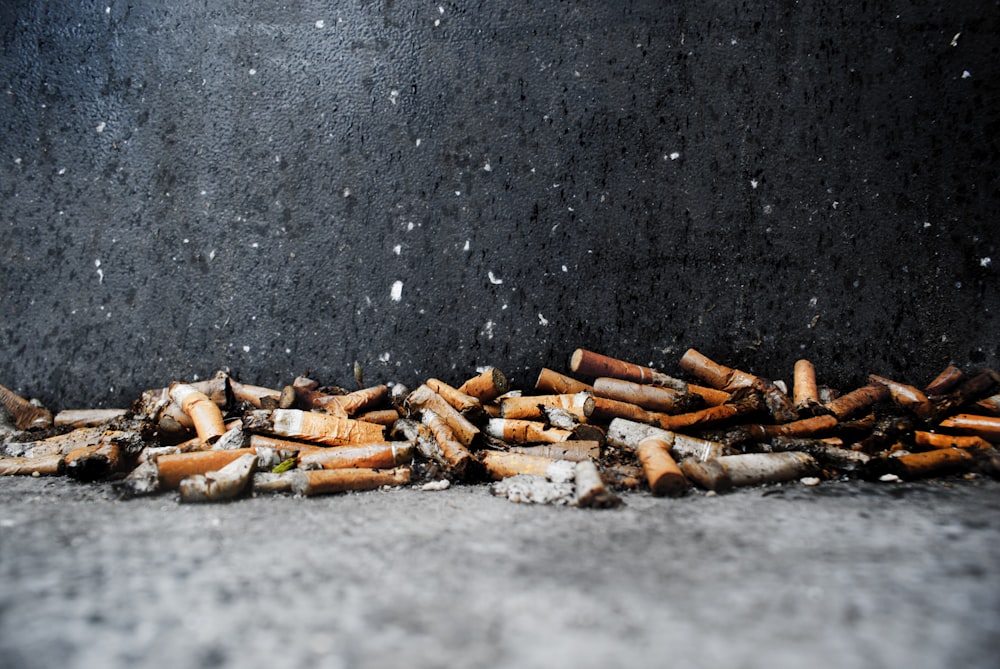 brown and gray firewood on gray concrete floor