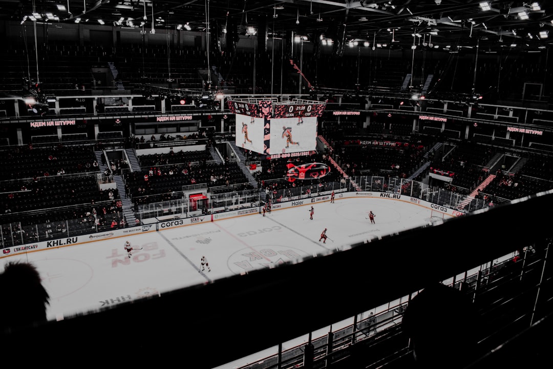 people playing ice hockey on stadium