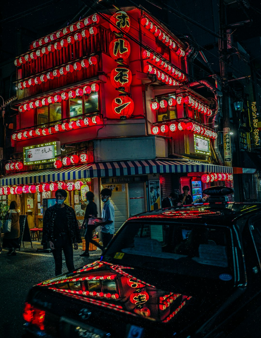 people walking on street during nighttime