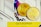 Two gold coins with the letters 'EXU' embossed on them are placed against a colorful, abstract geometric background. In the foreground, a yellow strip with the code 'QVTU5QPRSP' is visible, possibly indicating an affiliate or promotional code.