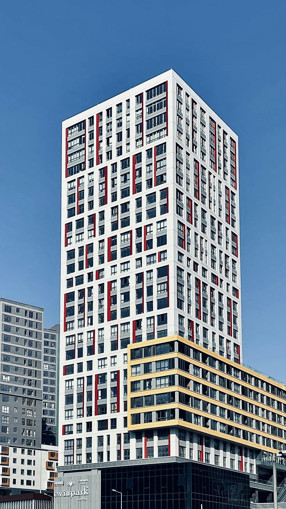 white and red concrete building under blue sky during daytime