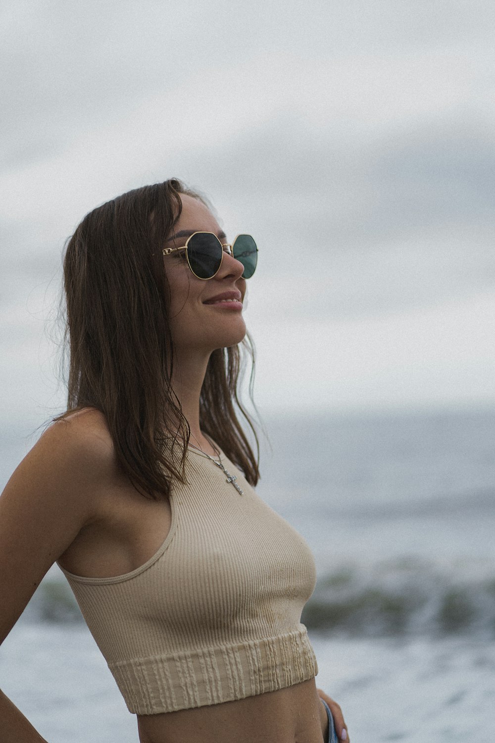 woman in white tank top wearing black sunglasses