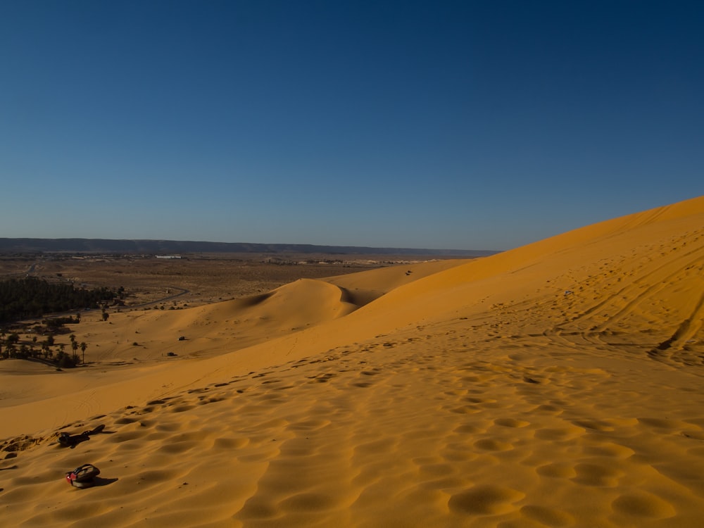 brown sand under blue sky during daytime