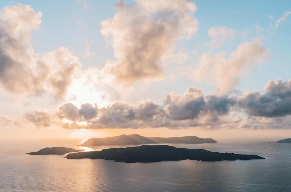 body of water under cloudy sky during daytime