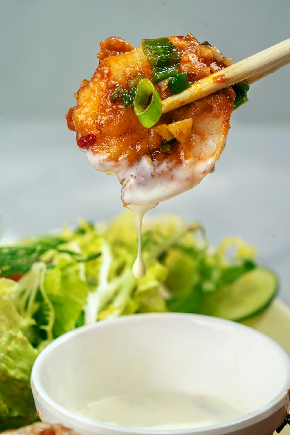 white ceramic plate with green vegetable and white cream