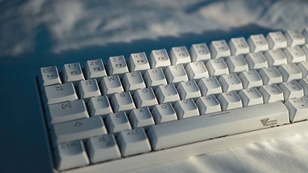 white computer keyboard on white table