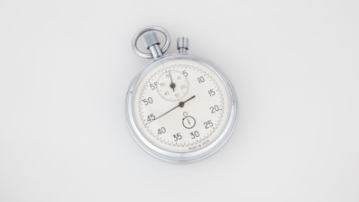 silver and white round analog watch