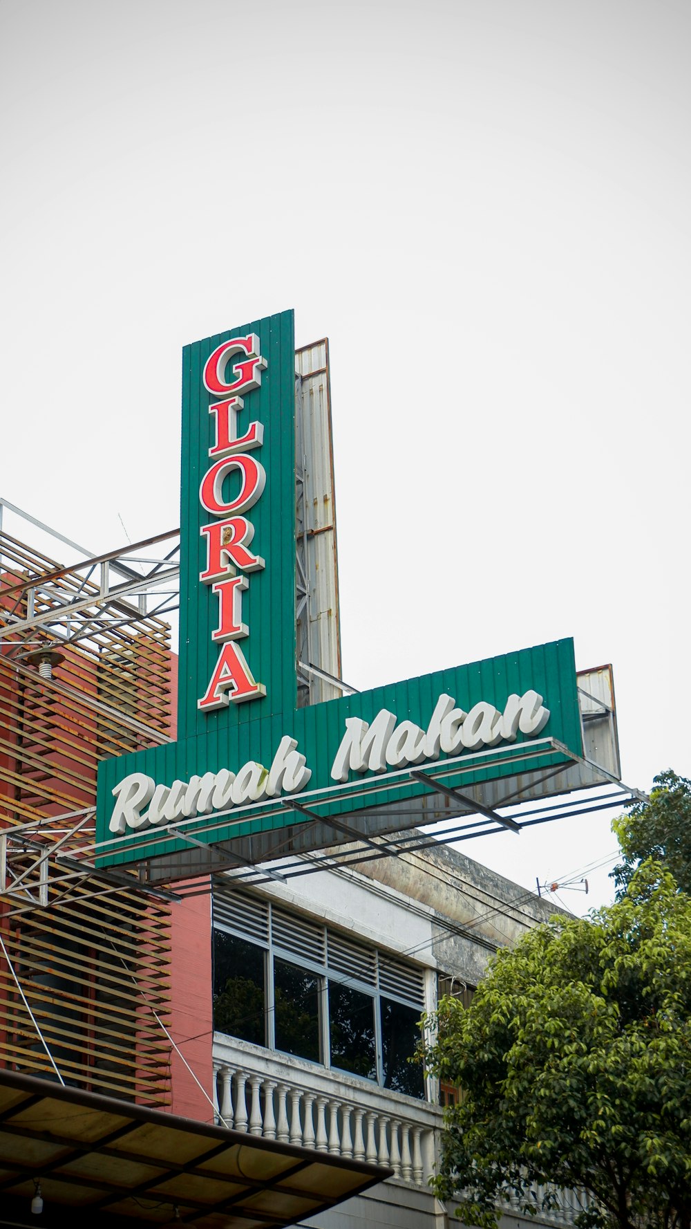 a large neon sign on the side of a building