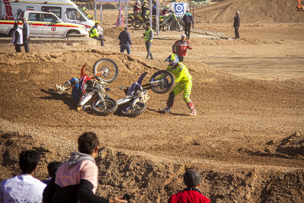 girl in red jacket and green pants riding motocross dirt bike