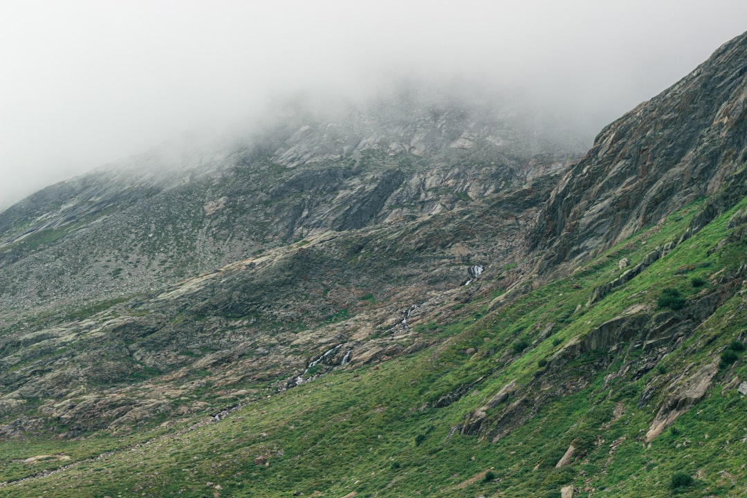 green and gray mountains under white sky during daytime