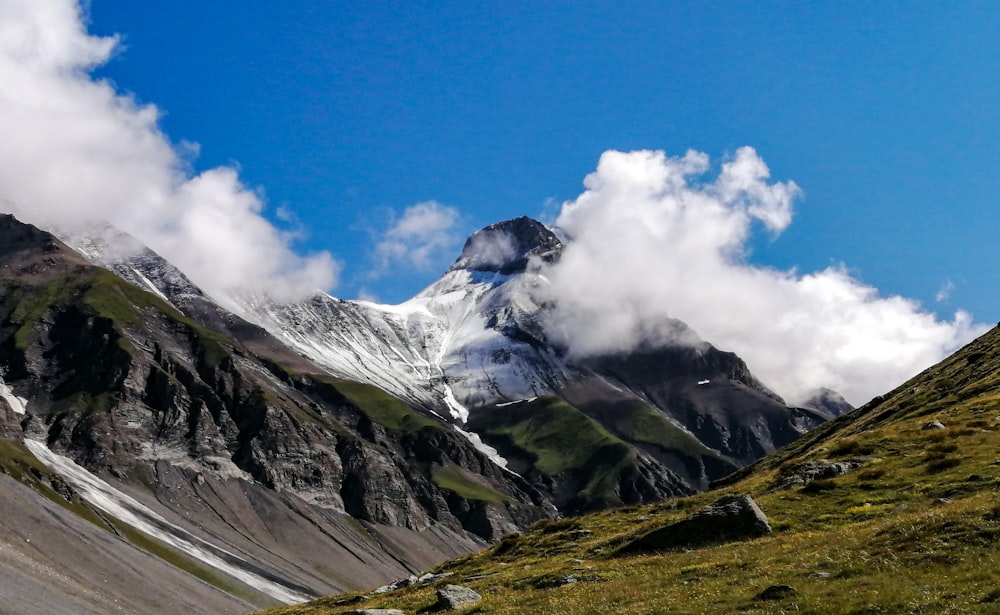 snow covered mountain under blue sky during daytime