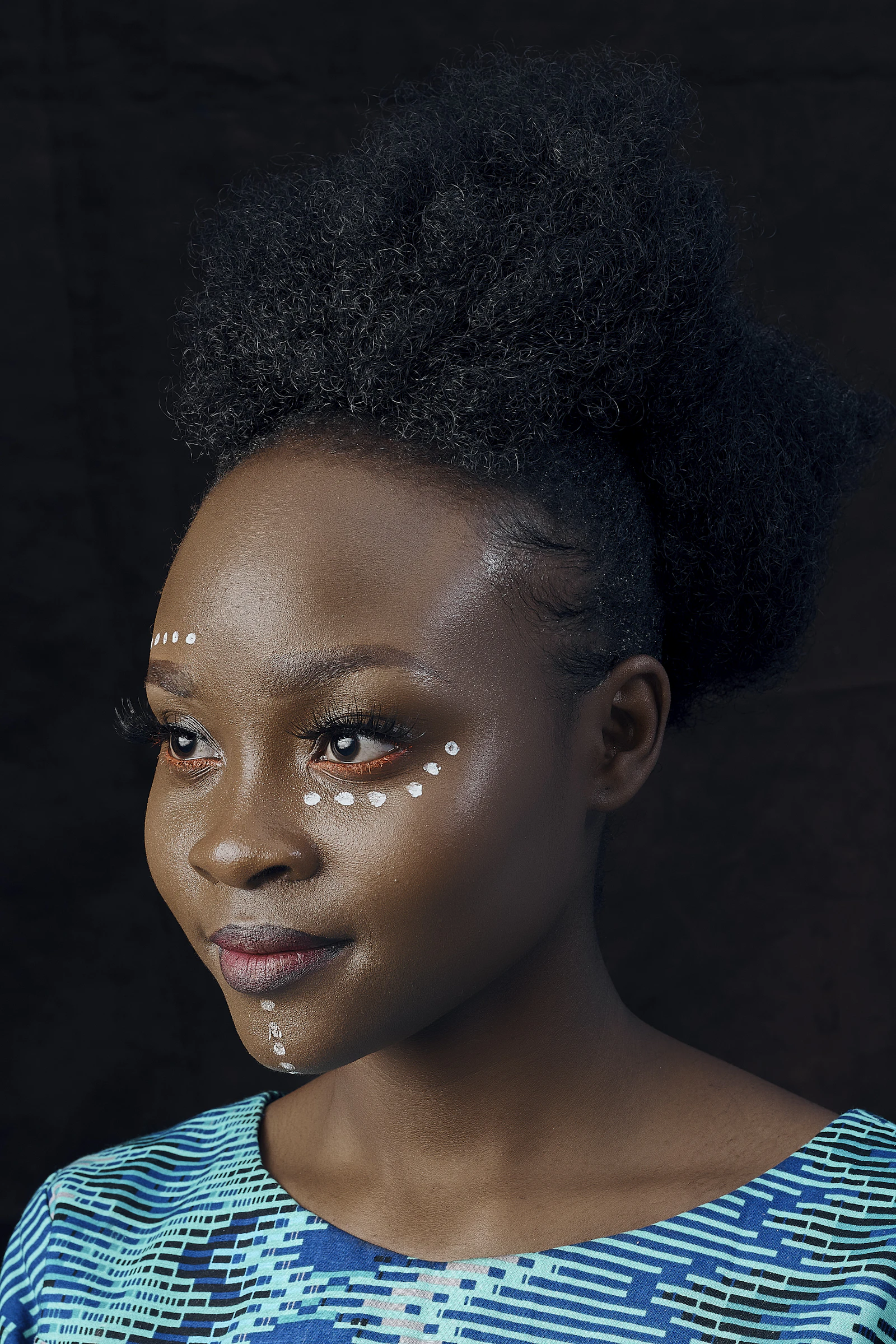 Portrait of a woman with dark skin tone and red lipstick