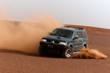 A dynamic Nissan SUV driving through a scenic landscape.