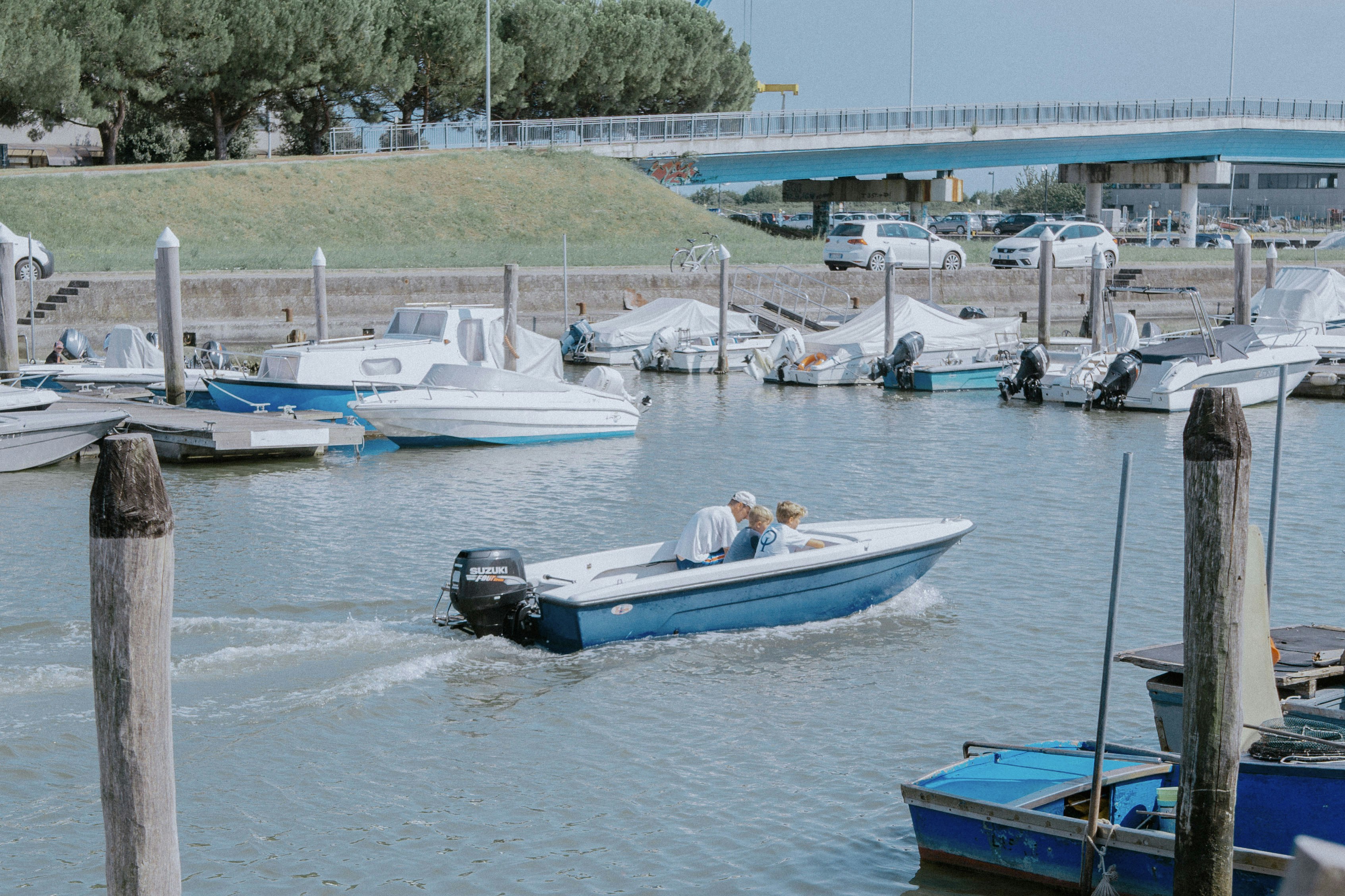 blue and white boat on water during daytime