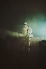 man in black jacket standing on stage