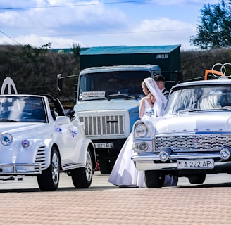 man and woman in white vintage car