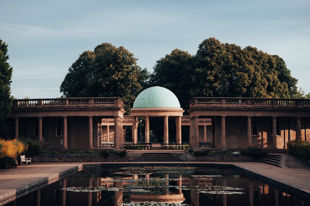 white dome building near green trees during daytime