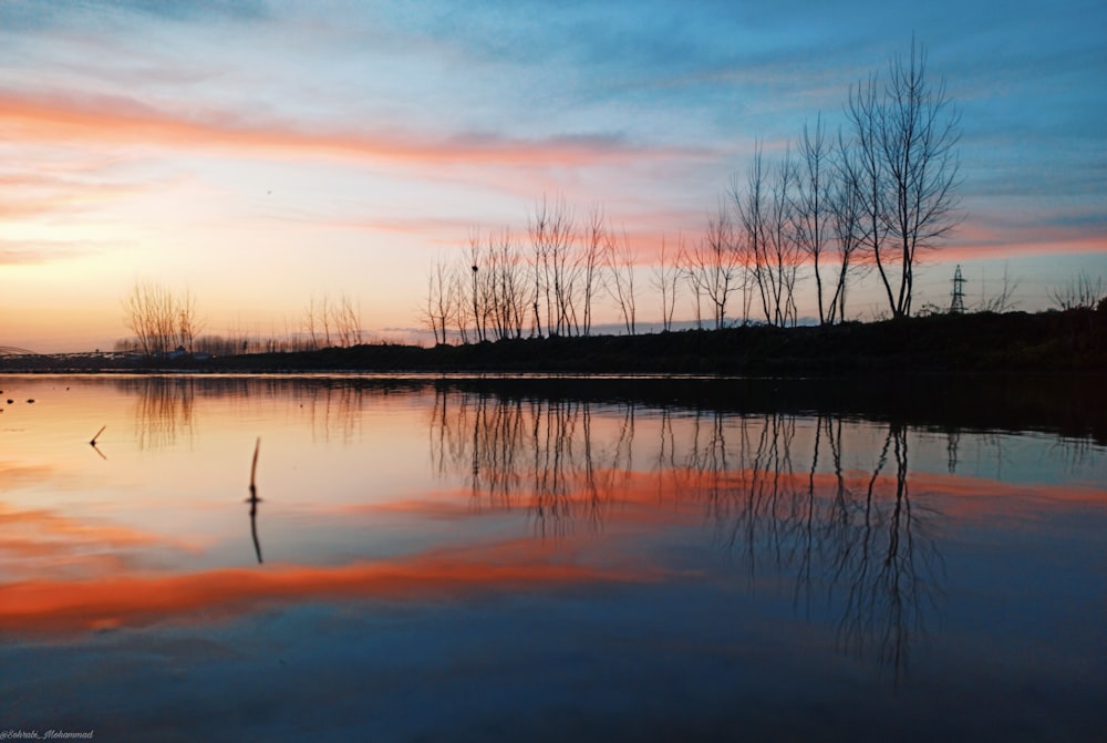 body of water during sunset