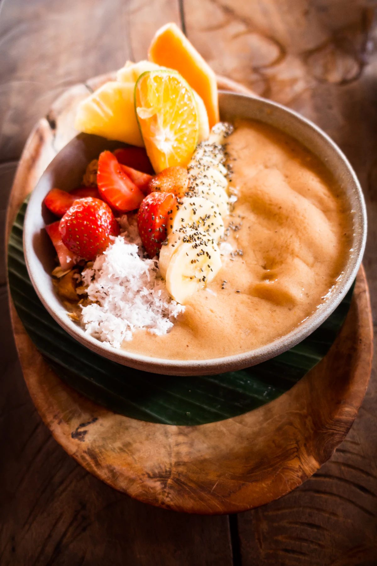 Chocolate smoothie bowl topped with fresh berries and seeds