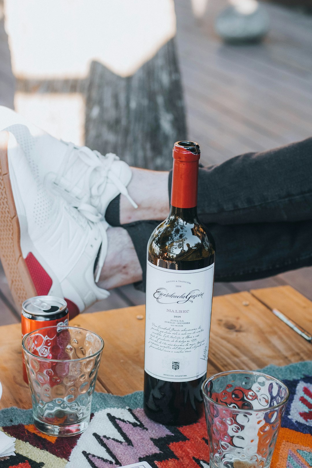 white labeled bottle on brown wooden table