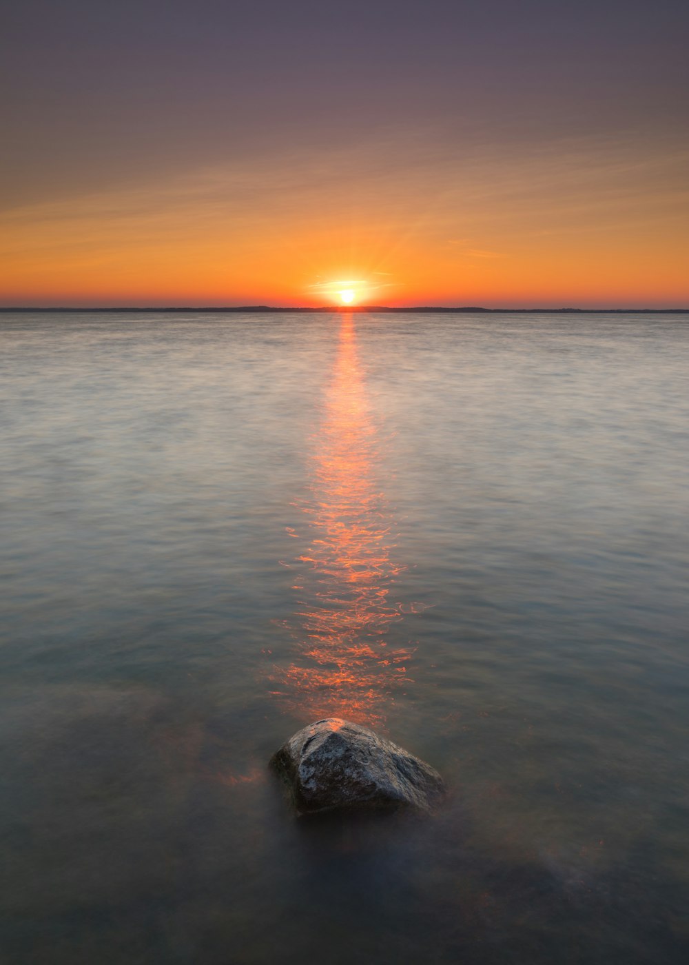 body of water during sunset