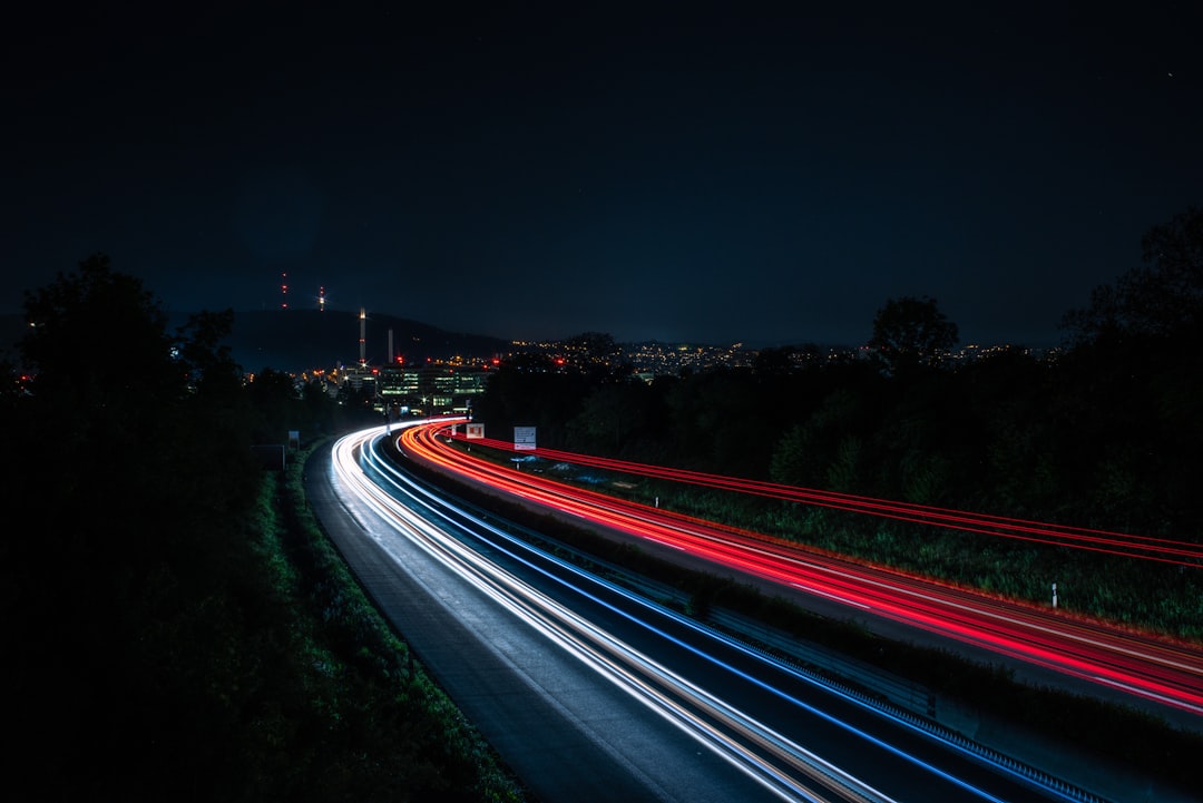 time lapse photography of cars on road during night time