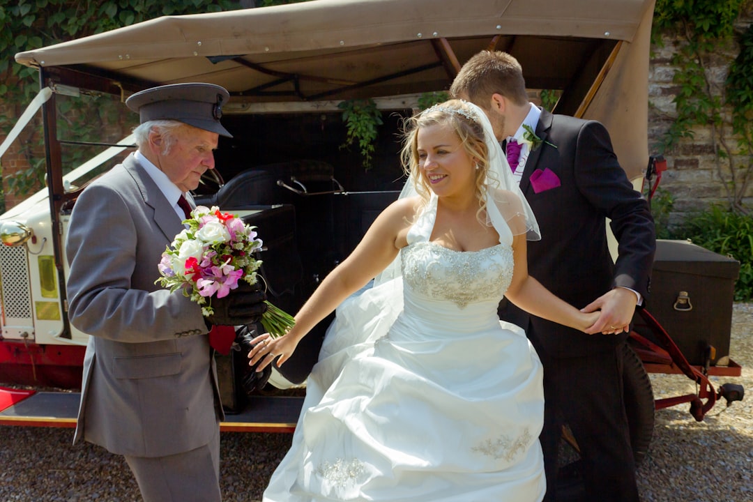 woman in white wedding dress holding bouquet of flowers