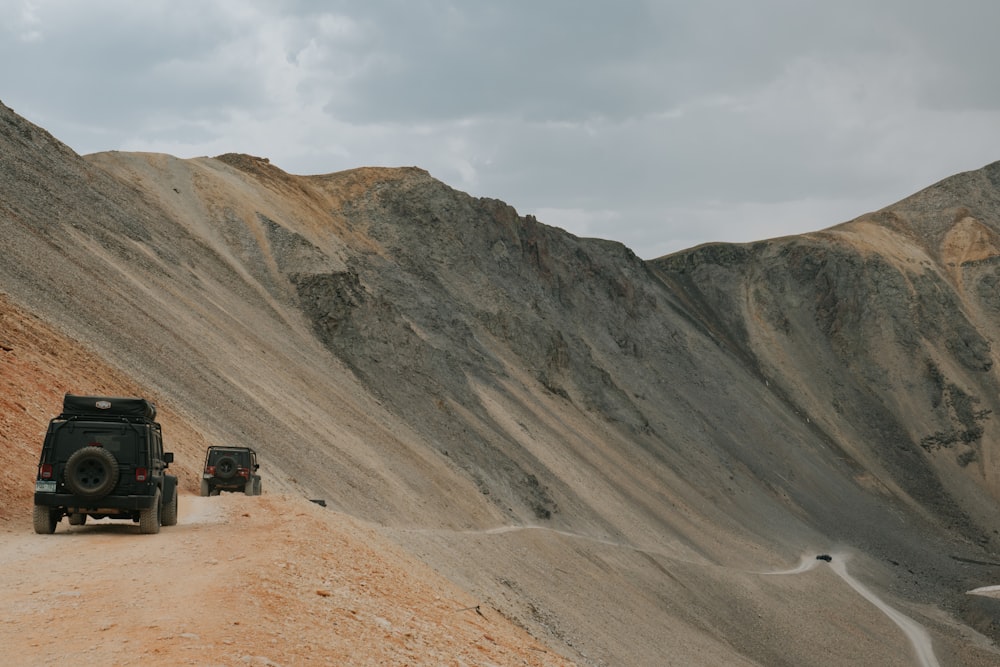 brown and gray mountains under white clouds during daytime