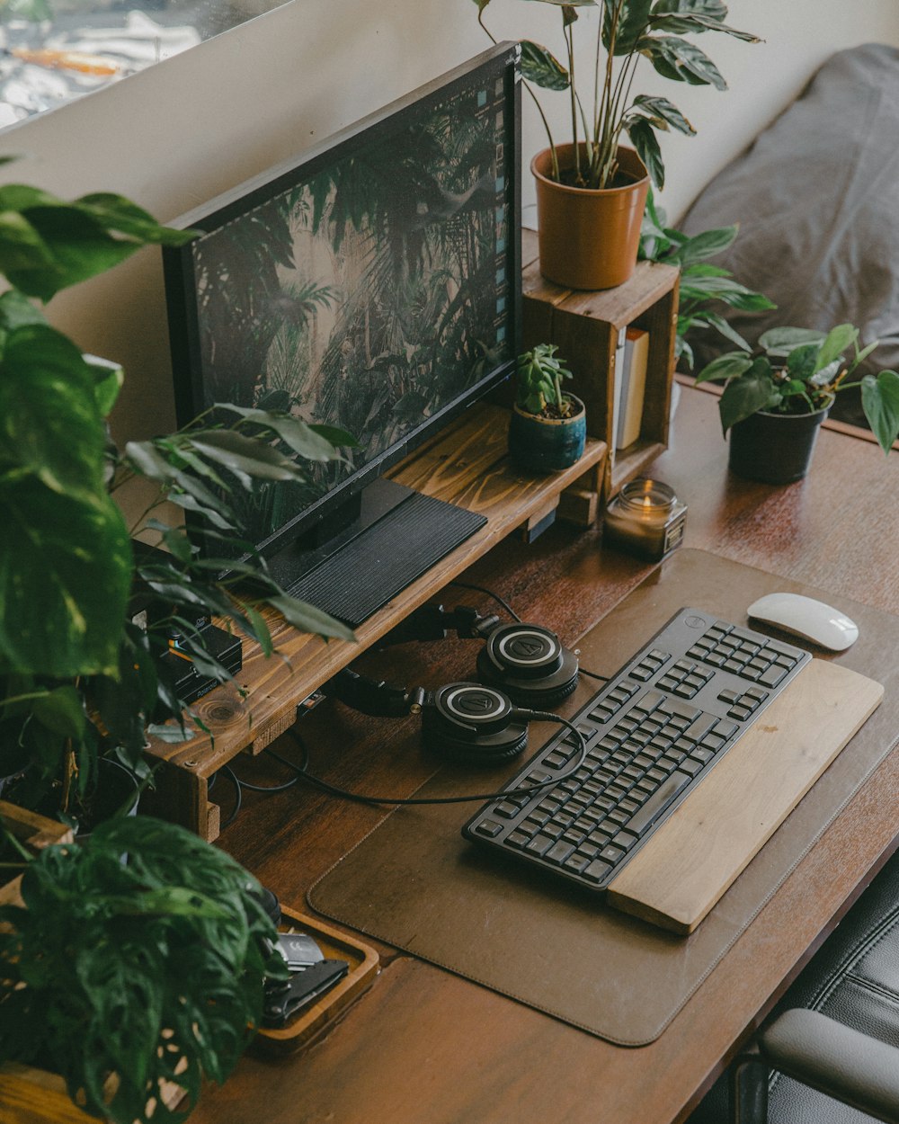 black computer keyboard beside black computer monitor