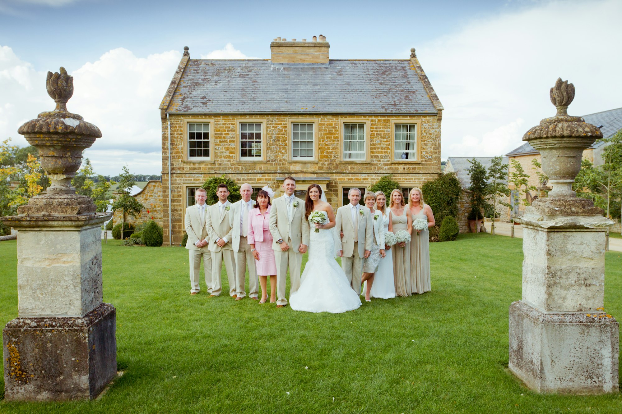 people posing outside wedding venue