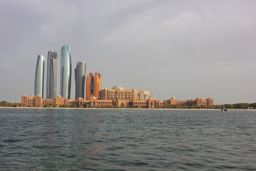 city skyline across body of water during daytime