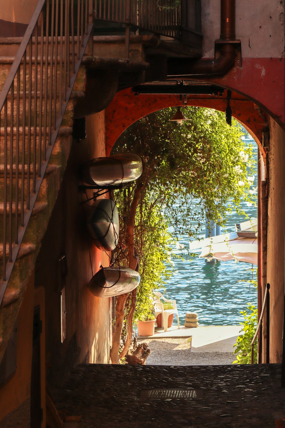 brown wooden arch near green trees during daytime