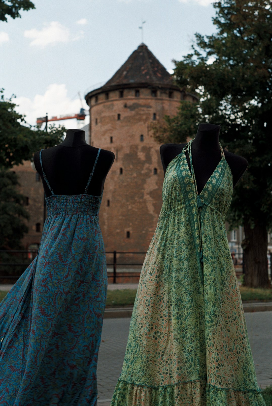 blue and green dress on black clothes hanger