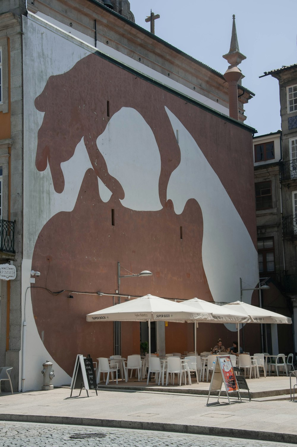 brown and white wooden wall with graffiti