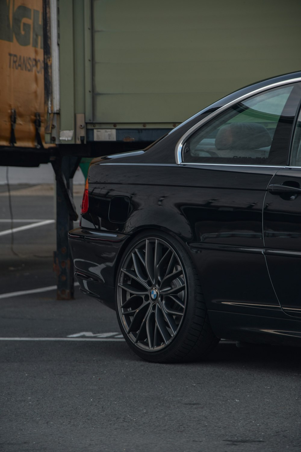 black car parked on gray concrete floor