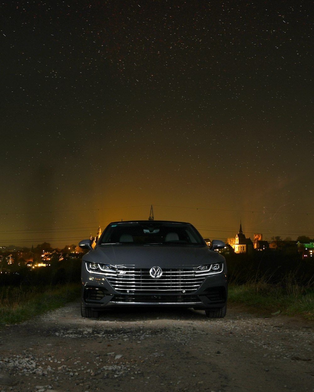 black car on road during night time