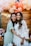 woman in white shirt smiling beside woman in white shirt