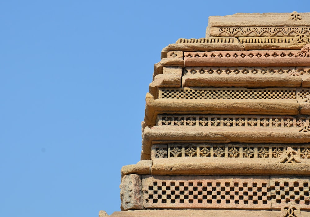 brown concrete building under blue sky during daytime