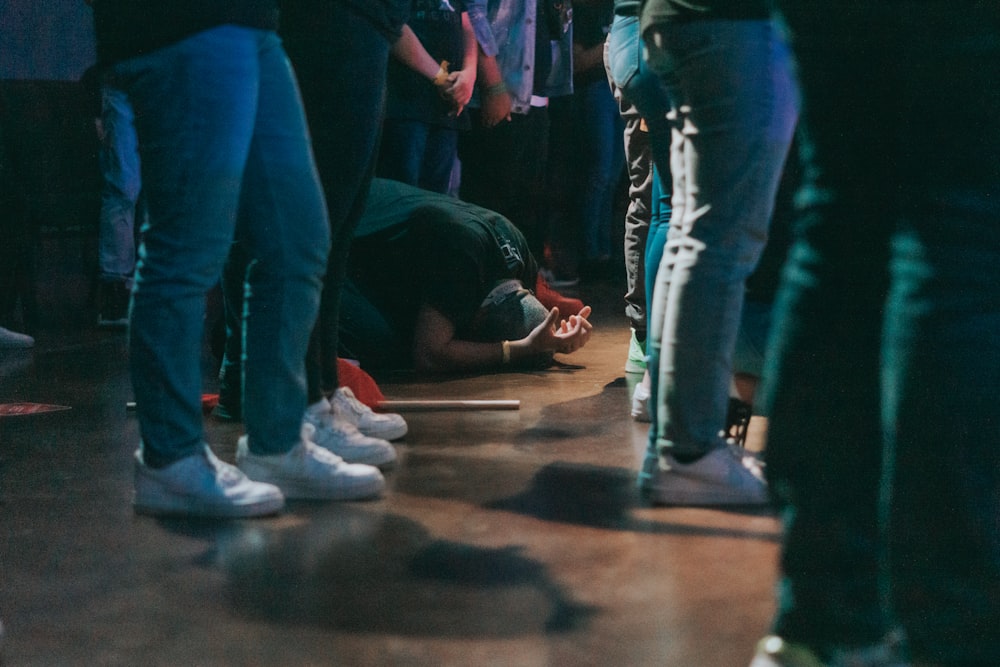 people standing on brown wooden floor