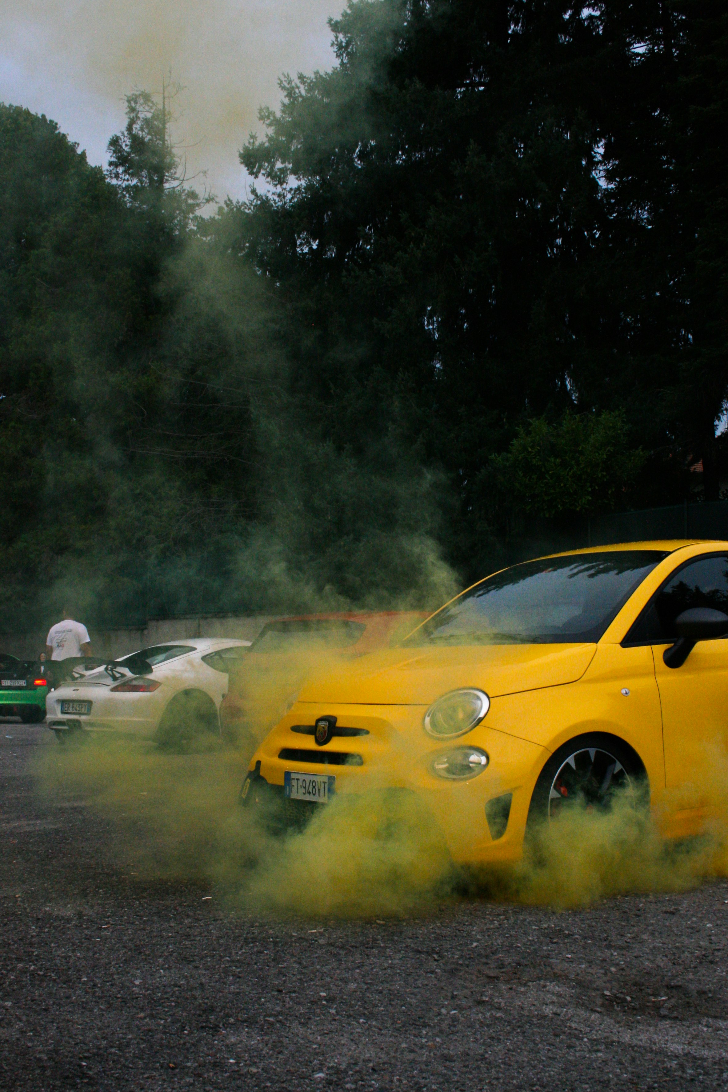 yellow coupe on road during daytime