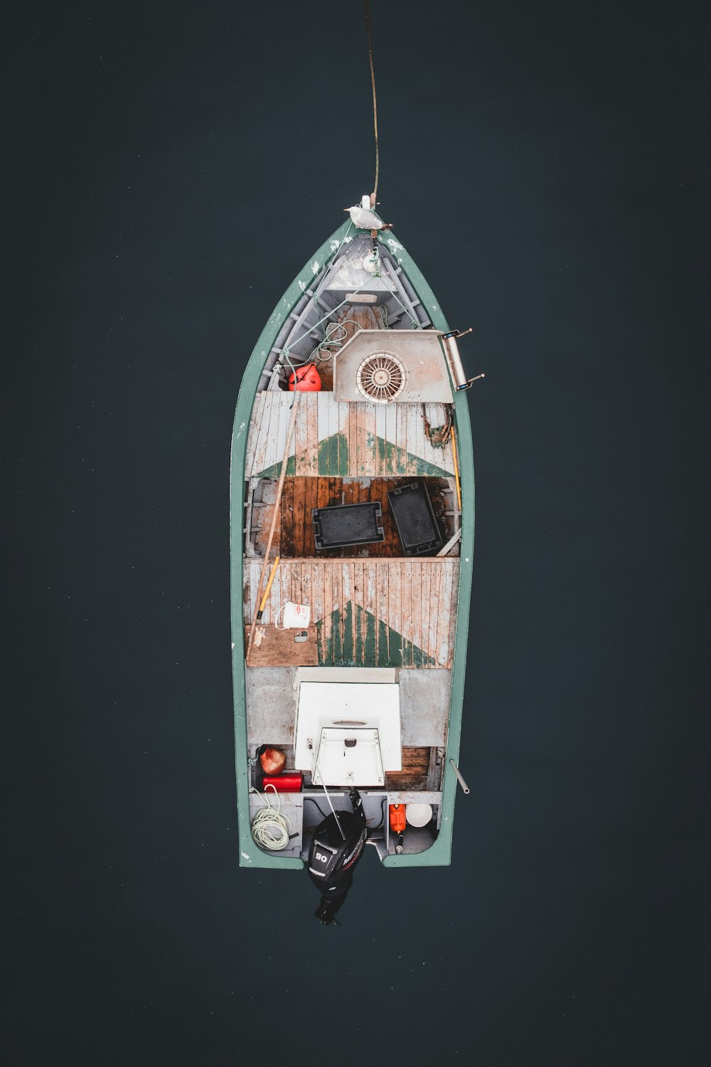 white and brown wooden boat on water