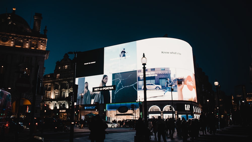 people walking on street during night time