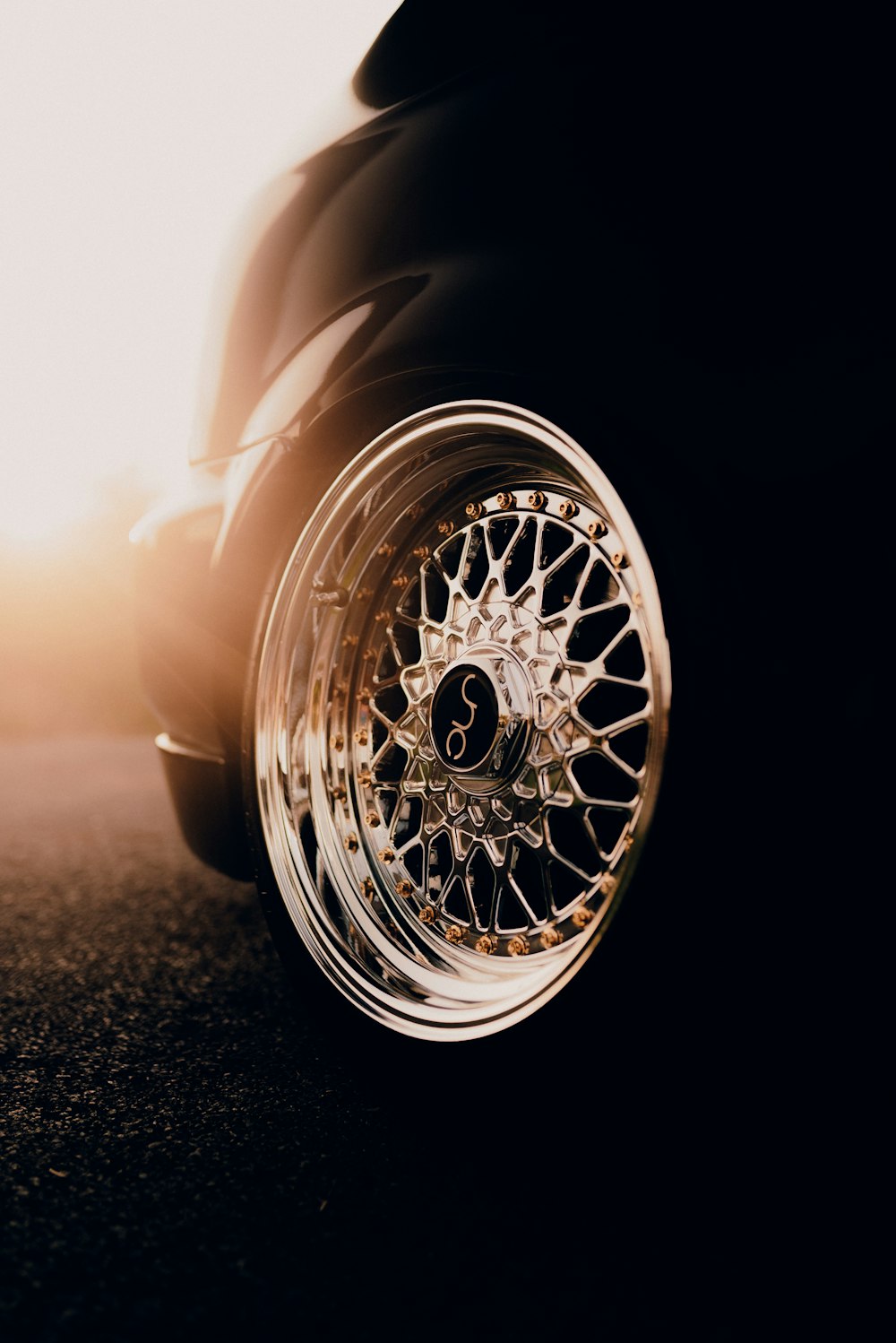 grayscale photo of car wheel