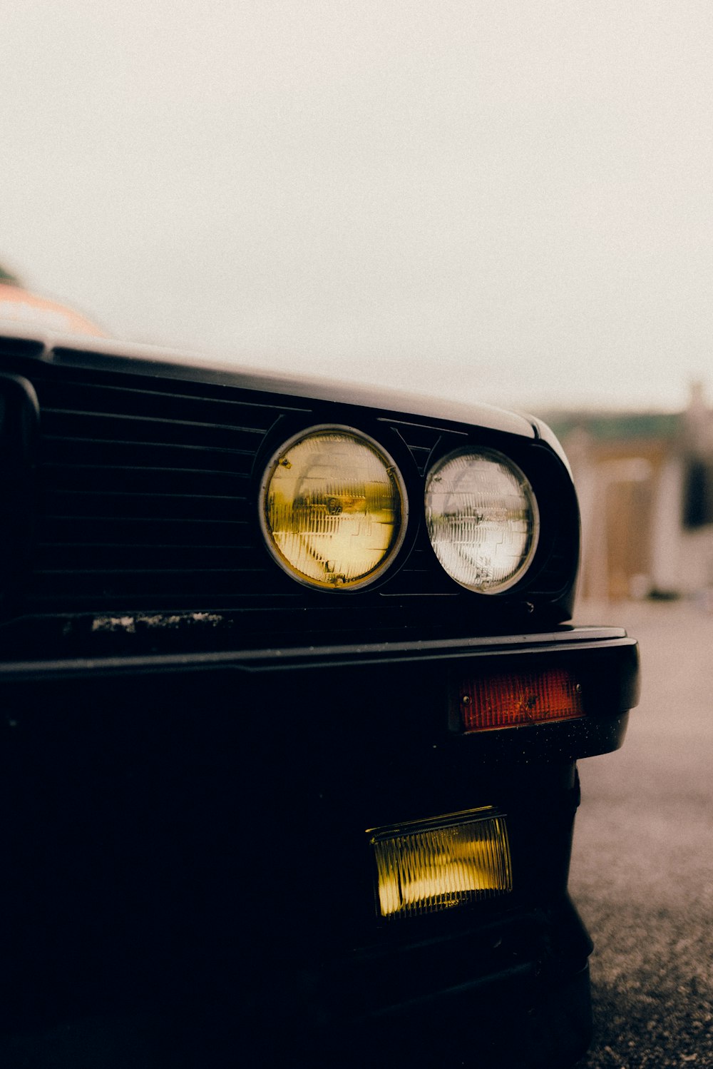 black car with white and yellow light