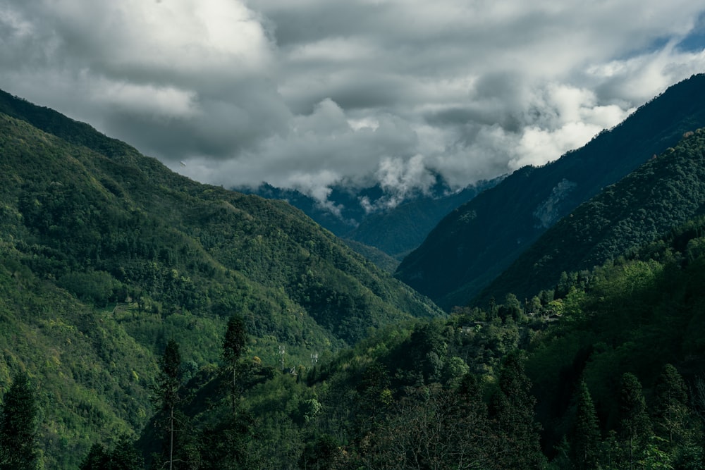 green mountains under white clouds during daytime