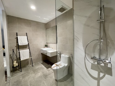white ceramic sink near white ceramic sink