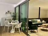 Open lounge space featuring casual seating and indoor plants.