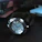 Close-up of a sophisticated gentleman wearing a sleek Aurelius Timepiece in a dimly lit, elegant room.