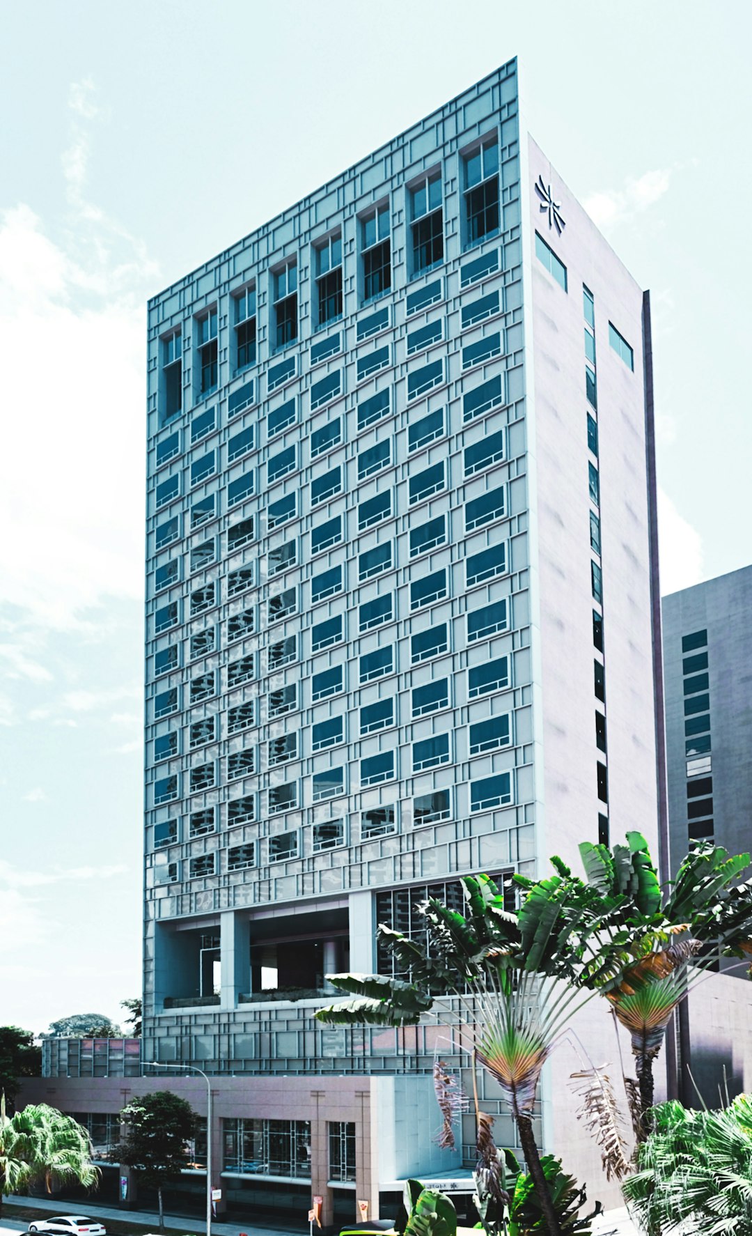 white concrete building under white sky during daytime