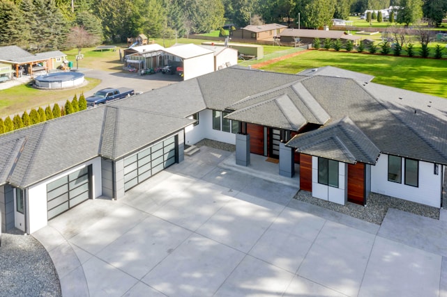 A freshly poured, smooth concrete driveway with clean curved edges in a modern Bay Area home setting.